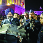 Indian Air Force officials display a wreckage of AMRAAM air-to-air missile that they say was fired by Pakistan Air Force fighter jet during a strike over Kashmir on Wednesday, after speaking with media in lawns of India’s Defence Ministry in New Delhi