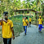 Workers with the nonprofit Mission Rabies catch stray dogs to vaccinate them against the disease in Goa, India. (Atul Loke/The New York Times)