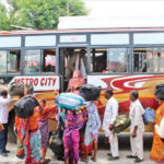 Amarnath pilgrims boarding a bus from Bhagwati Nagar base camp after the J&K administration on Friday advised tourists and yatris to curtail their stay in the Valley immediately. IANS