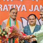 Former Congress leader Sanjay Singh welcomed into the BJP by party leaders J.P. Nadda and Bhupender Yadav, at the party’s headquarters in New Delhi, on Wednesday. IANS