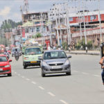 Vehicles ply on a Srinagar road on 16 August. IANS