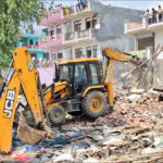 Bulldozers raze illegal structures in Noida Sector 63, as part of the anti-encroachment drive.