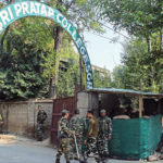 Security personnel outside a college in Srinagar. PHOTO Muzamil Bhat