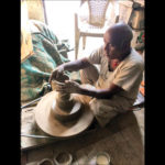 Sri Krishna, a potter, making diyas.