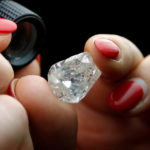 A 30-carat rough diamond is viewed at the offices of a polishing factory in Antwerp