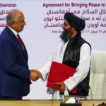 File photo of the deal signed in Doha between US special envoy Zalmay Khalilzad and Taliban political chief Mullah Abdul Ghani Baradar on 29 February.