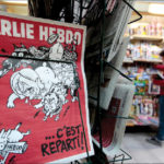 The front page of the new issue of satirical French weekly Charlie Hebdo entitled ‘C’est Reparti’ (‘Here we go again’), displayed at a kiosk in Nice on February 25, 2015. REUTERS