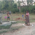 Keeping distance at handpumps in Bahraich.