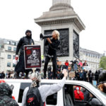 A demonstrator uses a megaphone during a Black Lives Matter