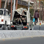 Army vehicle moving on a road, in Leh