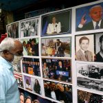 A shopkeeper display the pictures of Joe Biden and Kamala Harris as they going to take oath