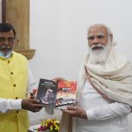 Senior journalist Ras Bihari presenting his three books on West Bengal politics to PM Narendra Modi (1)