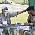 An old many bless an Army doctor during a medical cum veterinary camp organized by Army