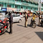 Security personnel inspect the vehicles as the city is on high-security alert after the killing of two school teachers