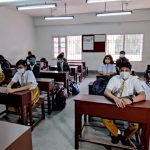 Students attend a class at Maharishi Vidya Mandir School as the schools reopen