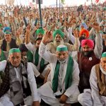 BKU leader Rakesh Tikait(C) with supporters shouting slogans at Ghazipur on the first anniversary of protest