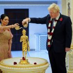 British PM Johnson and Home Secretary Priti Patel attend Diwali celebrations during a visit to the Hindu temple in London