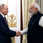 Prime Minister Narendra Modi greets Russian President Vladimir Putin at the 21st annual India-Russia summit