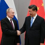 FILE PHOTO: Russian President Putin meets with Chinese President Xi during their meeting on the sideline of the BRICS summit in Brasilia