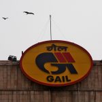 Birds fly past the logo of India’s state-owned natural gas utility GAIL (India) Ltd in New Delhi