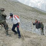 Army personnel assist the pilgrims during their journey to the Amarnath shrine