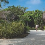 ATMOSPHERE KANIFUSHI MALDIVES – ACTIVITIES – AKIRI SPA – SPA THERAPIST WALKING