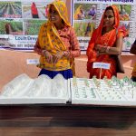 Ramgani and her neighbour explaining how they chnaged their crops for better yields