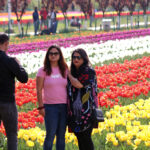 Tourists take a selfie at Tulip Garden