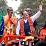 JP Nadda greets the gathering during a roadshow for the Telangana Assembly elections