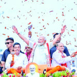 Prime Minister Narendra Modi holds a roadshow