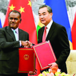 Chinese State Councilor and Foreign Minister Wang Yi shakes hands with Solomon Islands Foreign Minister Jeremiah Manele during a ceremony in Beijing_TSG