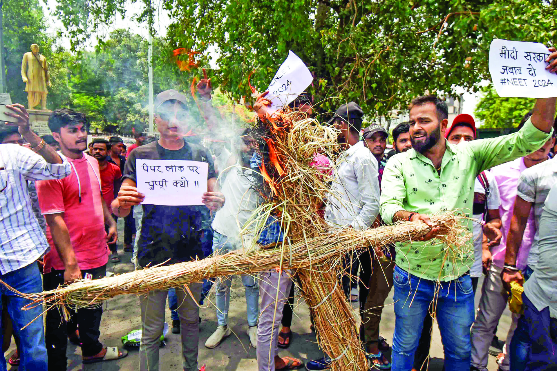 Students burn an effigy during their protest against the NEET UG entrance exam paper leak, in Patna on Saturday. ANI