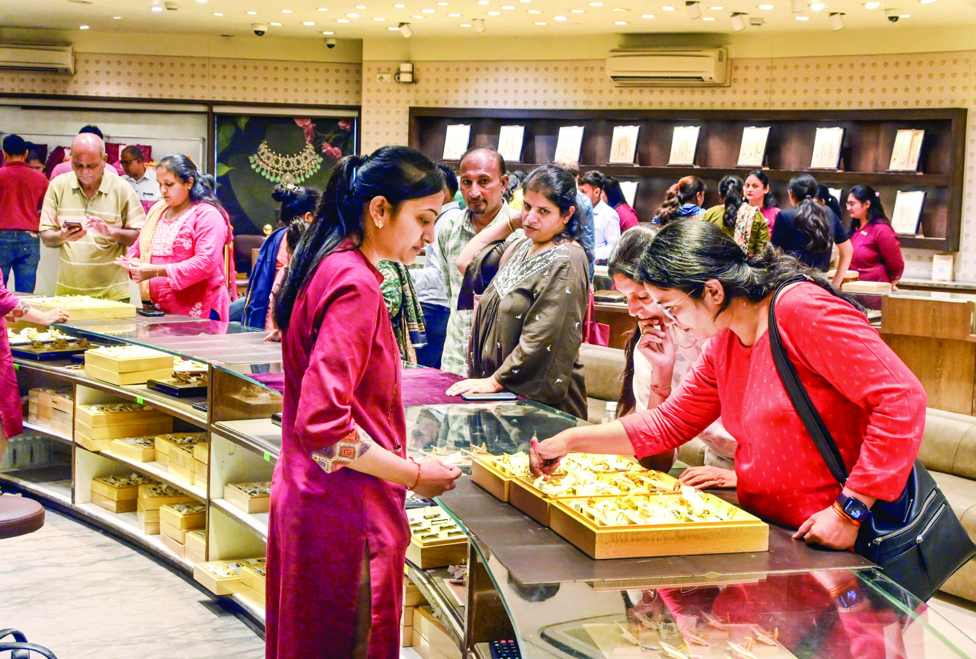 Women shop gold and silver jewelry on the occasion of ‘Pushya Nakshatra’ ahead of Diwali festival, in Ahmedabad on Thursday. ANI