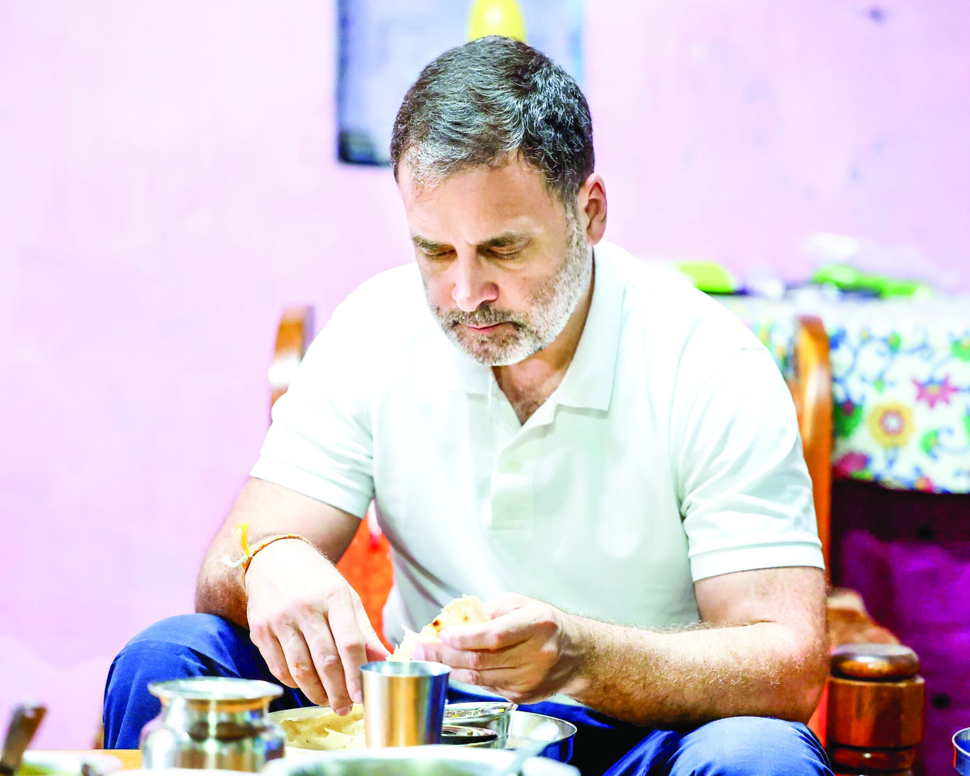 Lok Sabha LoP and Congress leader Rahul Gandhi eats at the house of a Dalit couple, in Kolhapur on Monday. ANI