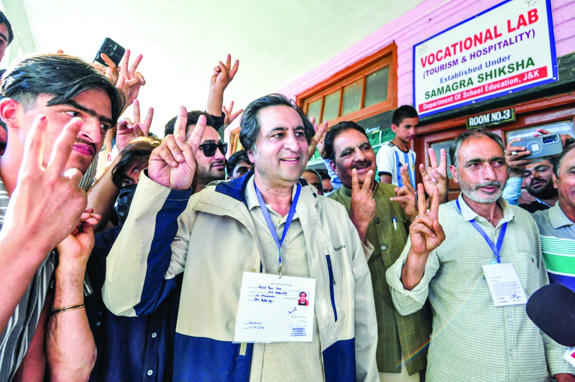 Sajad Gani Lone with his supporters after casting his vote in the Jammu and Kashmir Assembly elections, at Handwara in Kupwara on Oct 1, 2024. ANI