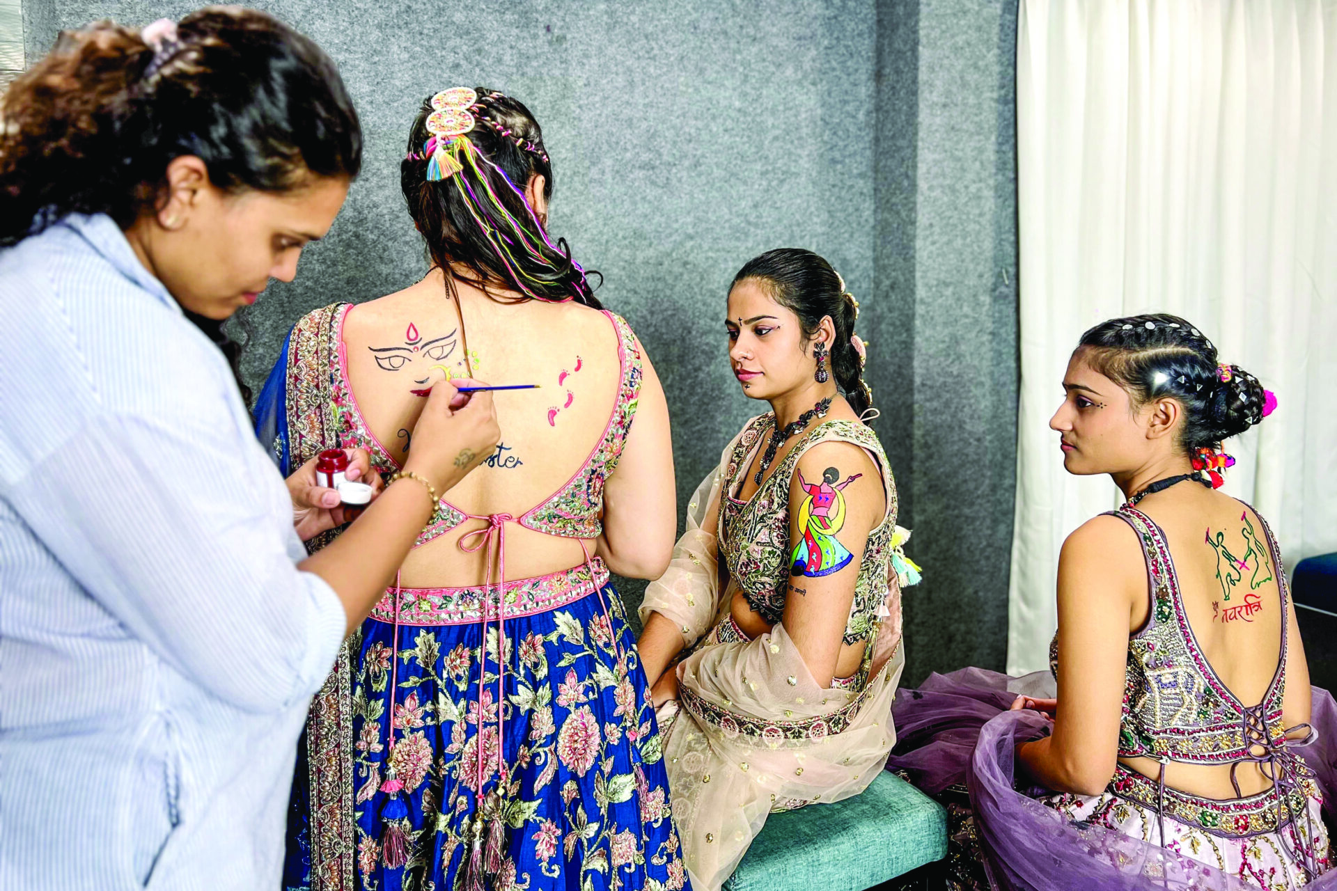 Representational photo: Women get their bodies inked with tattoos on the eve of the nine-day-long Navratri festival, in Surat on Wednesday. ANI