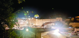 Western Wall with Dome of the Rock/Temple Mount in the background in Jerusalem.