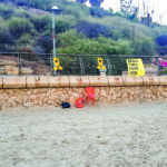 Yellow ribbons and Bring Them Home Now posters on Tel Aviv’s beach.