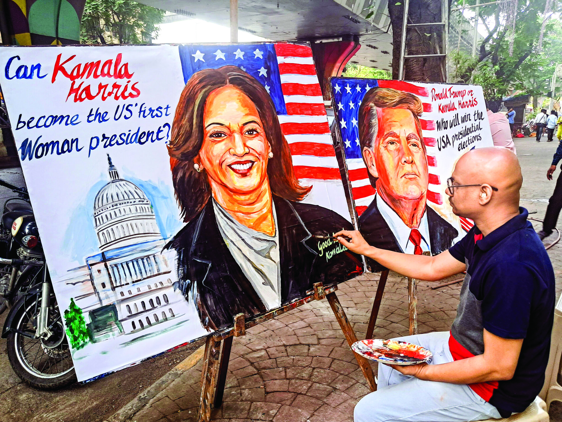 An artist draws portraits of US presidential candidates Kamala Harris and Donald Trump at the Gurukul School of Art ahead of the US Presidential elections, in Mumbai, on October 26. (ANI)