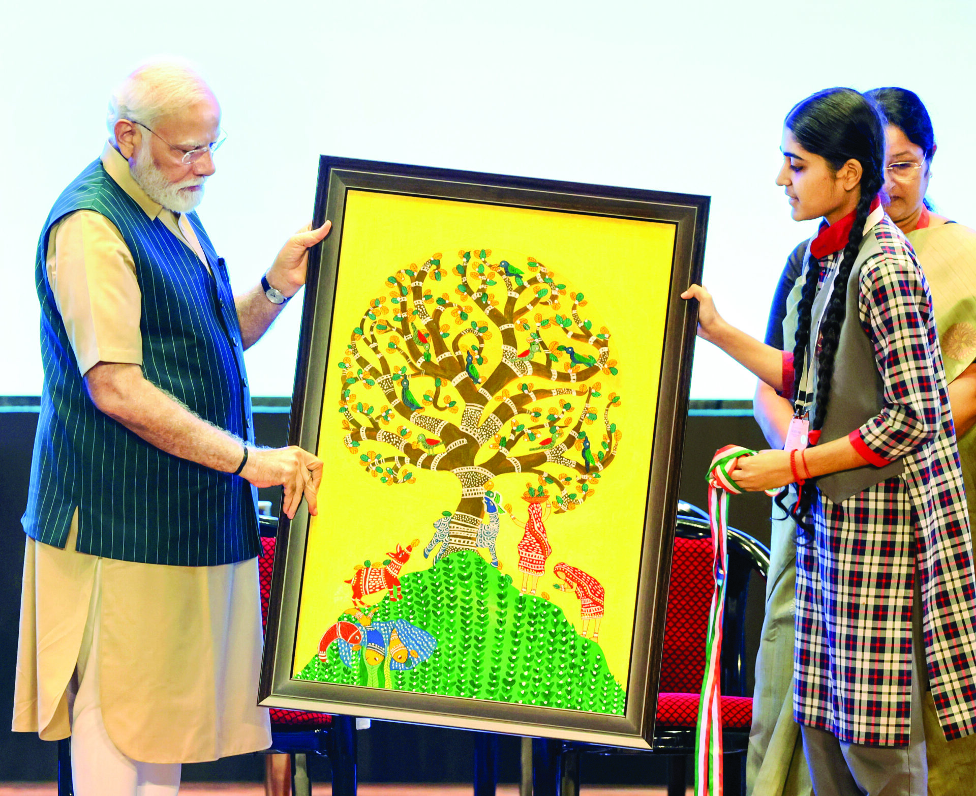 Prime Minister Narendra Modi being felicitated with a painting by a student at the inauguration of the ‘Akhil Bharatiya Shiksha Samagam’ in New Delhi on 29 July 2023. The event commemorated the third anniversary of NEP 2020. ANI