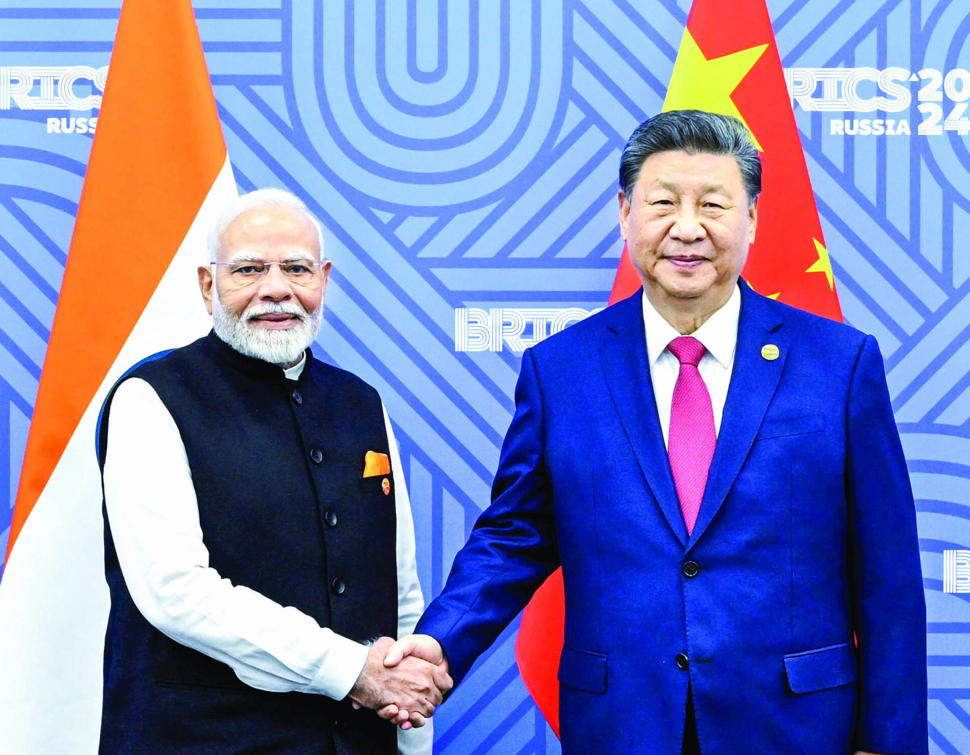 This 23 October photo shows Prime Minister Narendra Modi with Chinese President Xi Jinping on the sidelines of the BRICS Summit, in Kazan. ANI