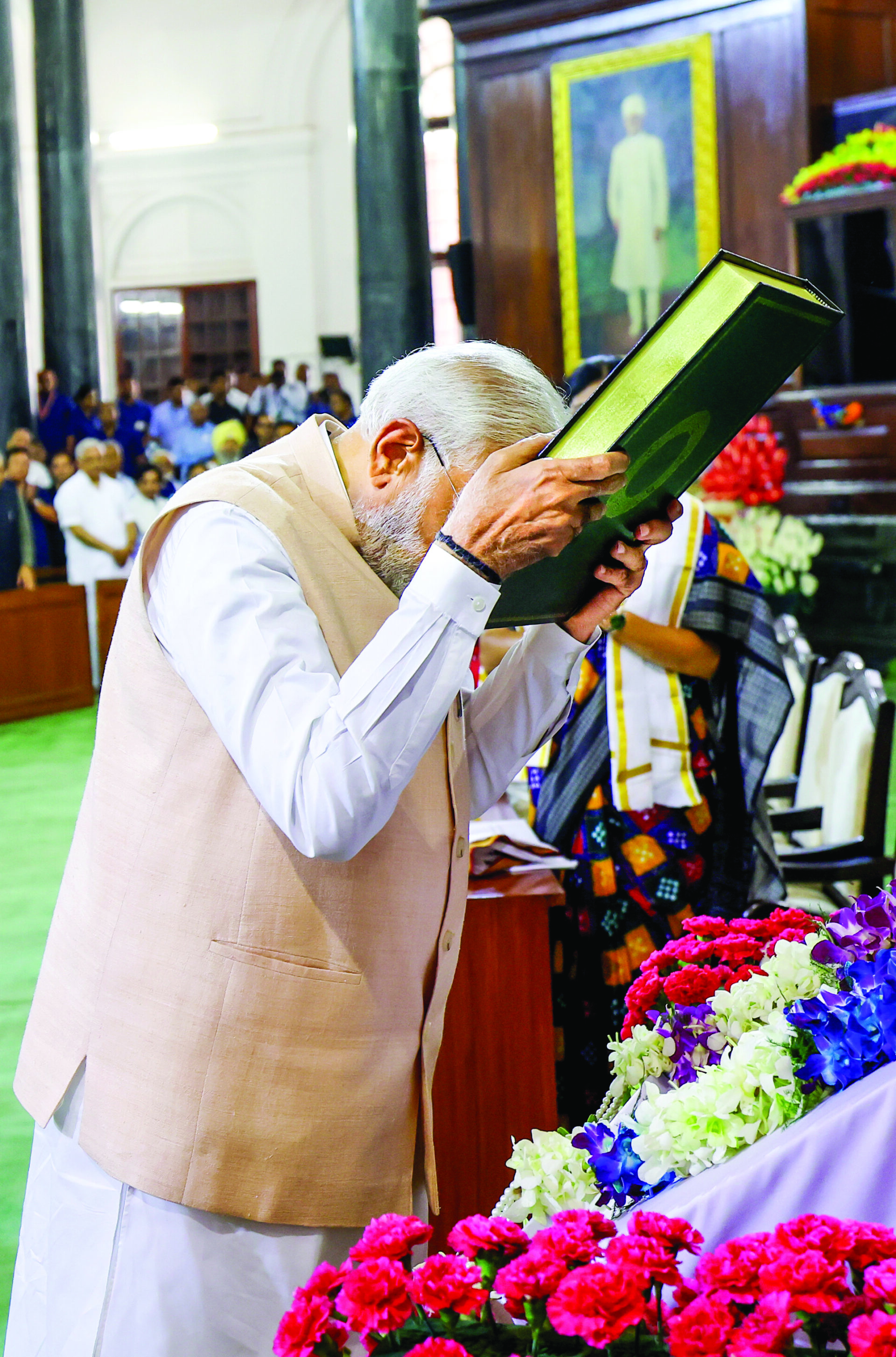 A 7 June 2024 file photo of Prime Minister Narendra Modi respectfully touching his forehead to the Constitution of India as he arrives for the NDA Parliamentary Party meeting, at the Samvidhan Sadan, in New Delhi. ANI