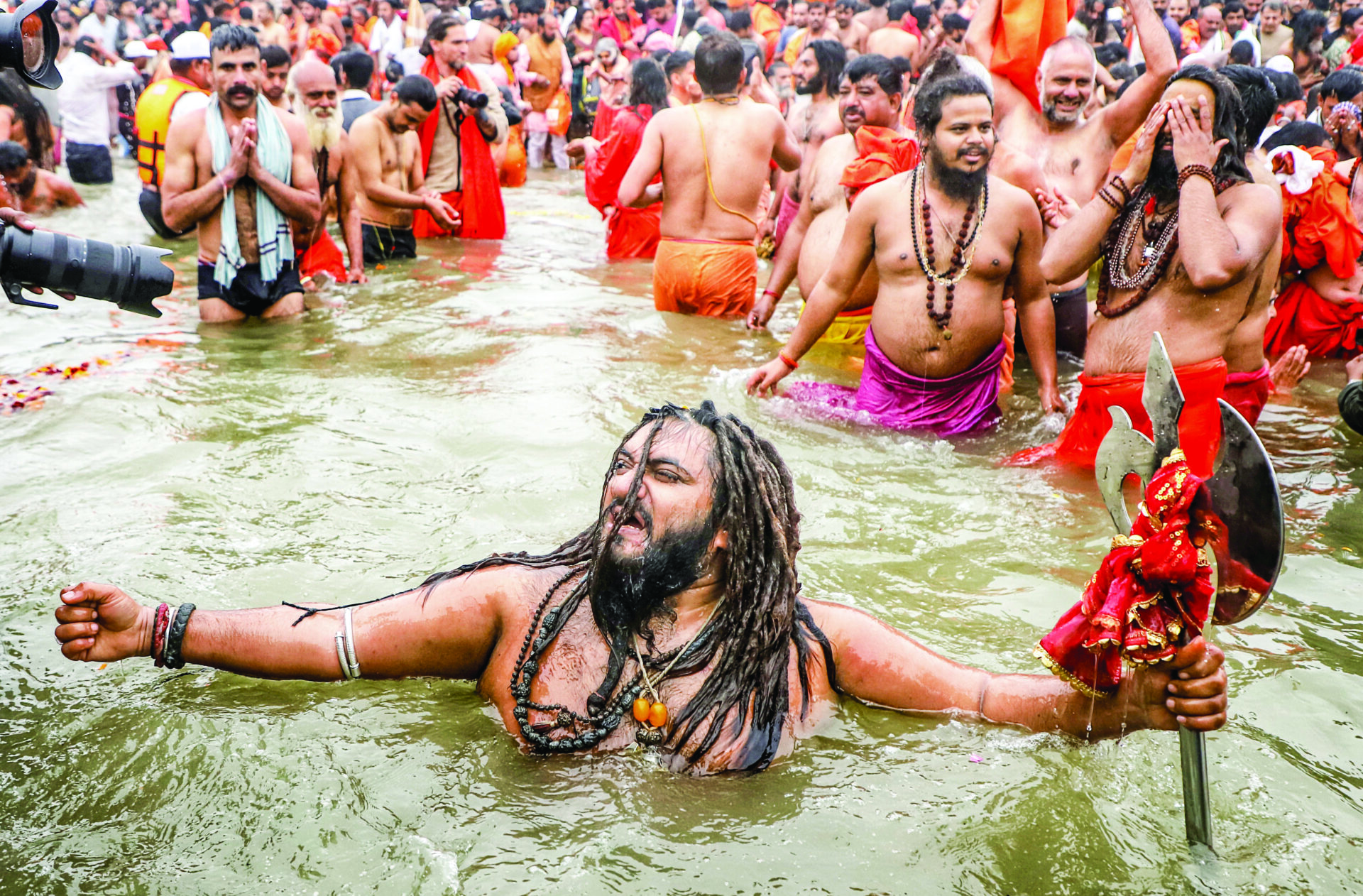 Sadhus take Amrit Snan at Triveni Sangam on Makar Sankranti during Maha Kumbh 2025, in Prayagraj on 14 January. ANI