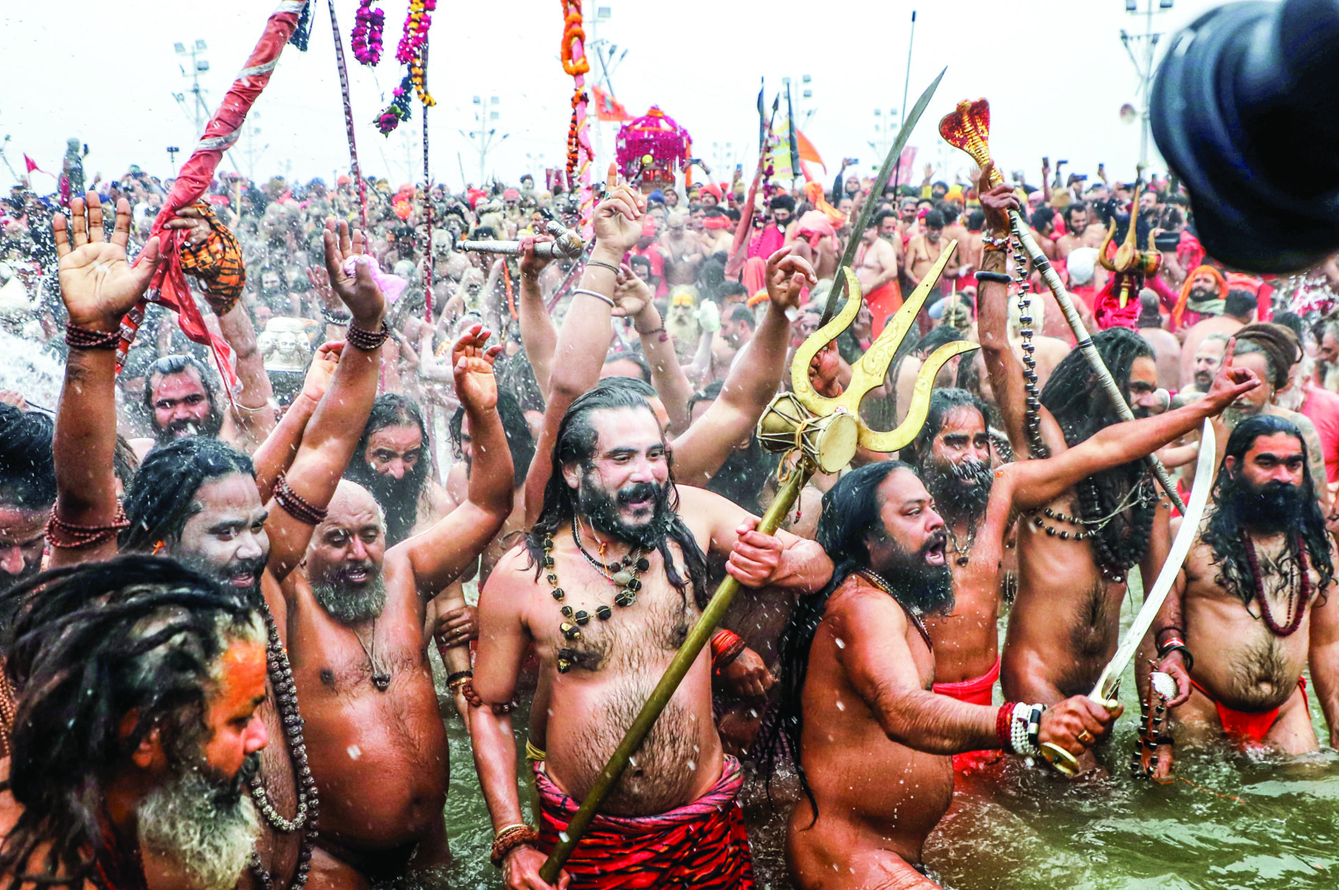 Naga sadhus take Amrit Snan at Triveni Sangam on the occasion of Makar Sankranti during the Maha Kumbh 2025, in Prayagraj on 14 January. ANI