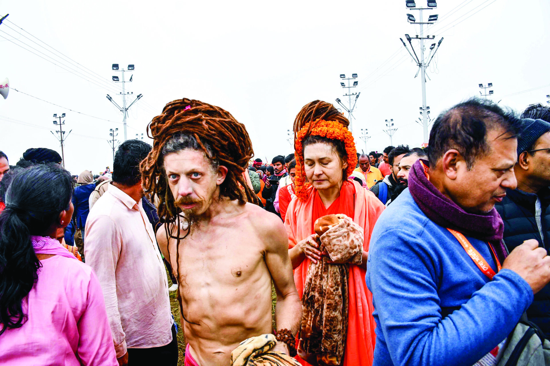 Foreign devotees gather to take a dip at Triveni Sangam on the occasion of Makar Sankranti during the Maha Kumbh 2025, in Prayagraj on 14 January. ANI