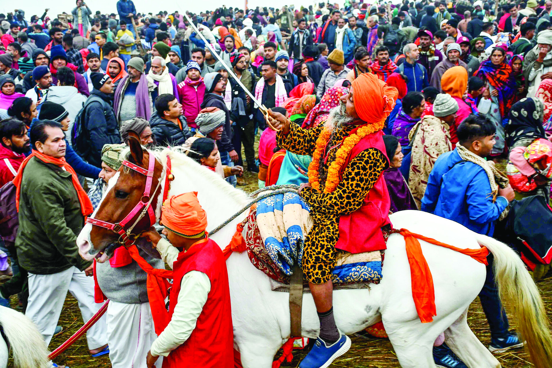 Devotees gather to take a dip at Triveni Sangam on Makar Sankranti during the ongoing Maha Kumbh 2025, in Prayagraj on 14 January. ANI