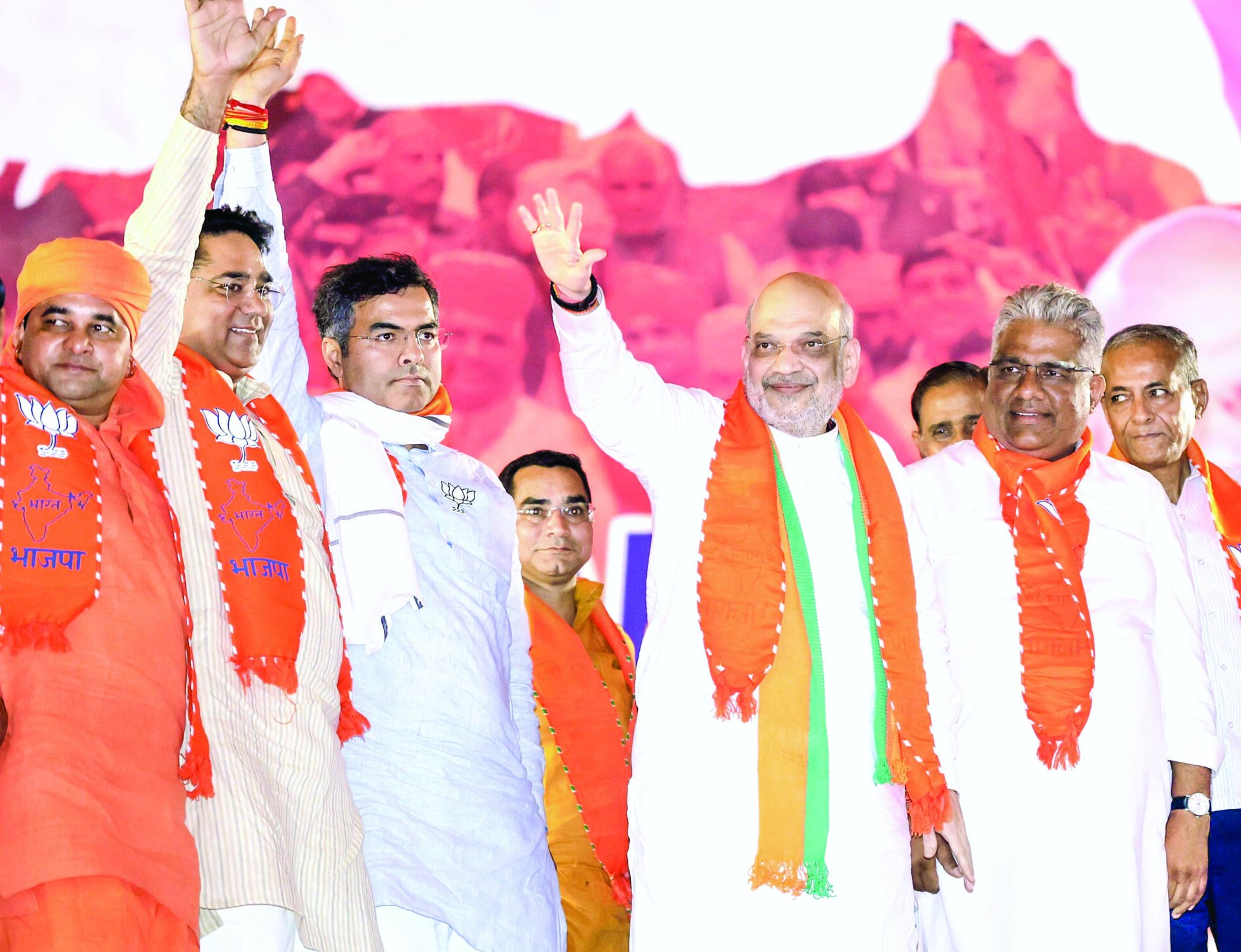 Union Home Minister Amit Shah with Union Minister for Environment, Forest & Climate Change Bhupender Yadav and Parvesh Verma (Left) at a public meeting ahead of Lok Sabha polls, in Alwar on April 13, 2024. ANI