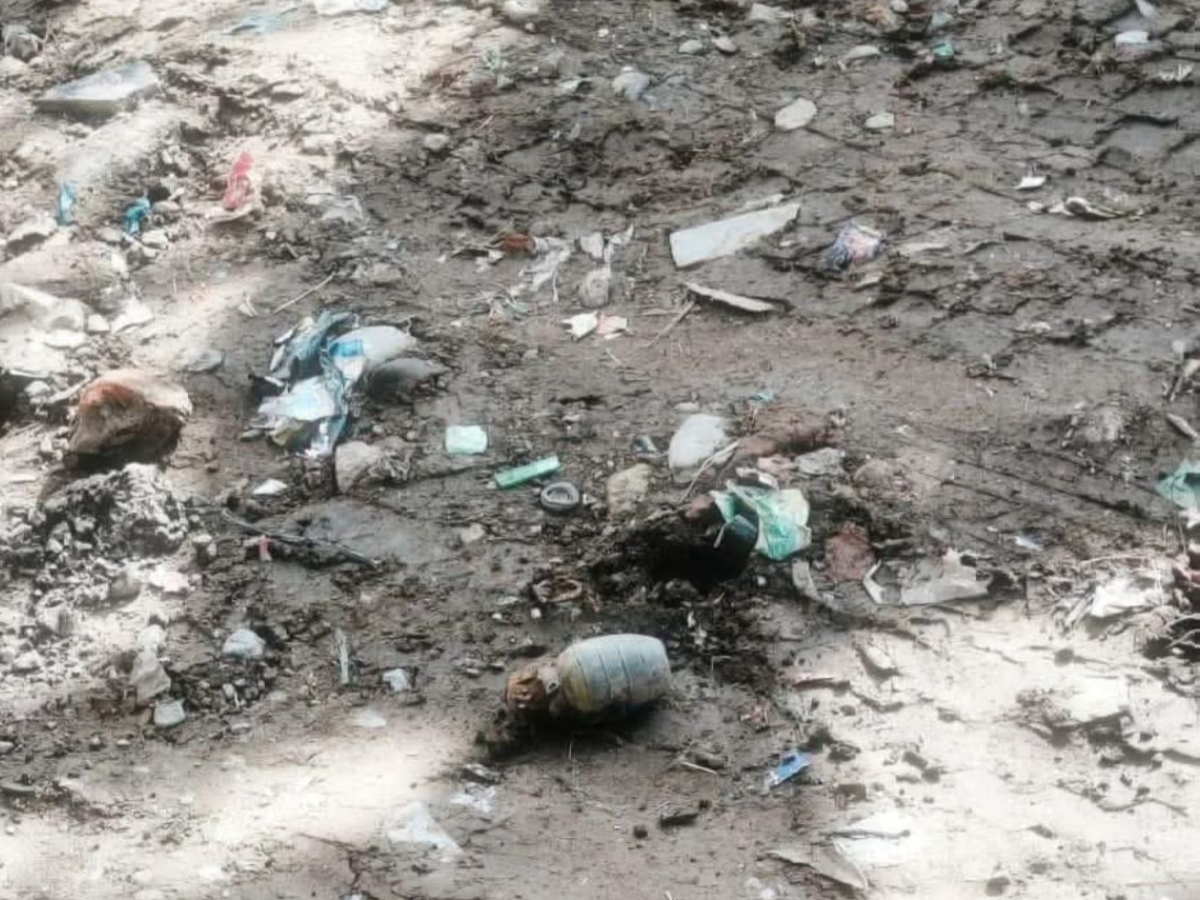 Bomb Disposal Squad secures and removes a rusted hand grenade recovered from a garbage dump in Srinagar’s Safakadal area.