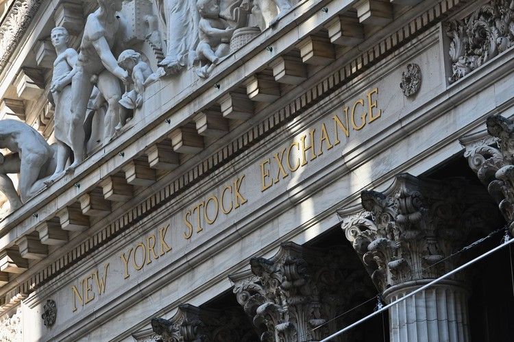 Traders work on the floor of the New York Stock Exchange