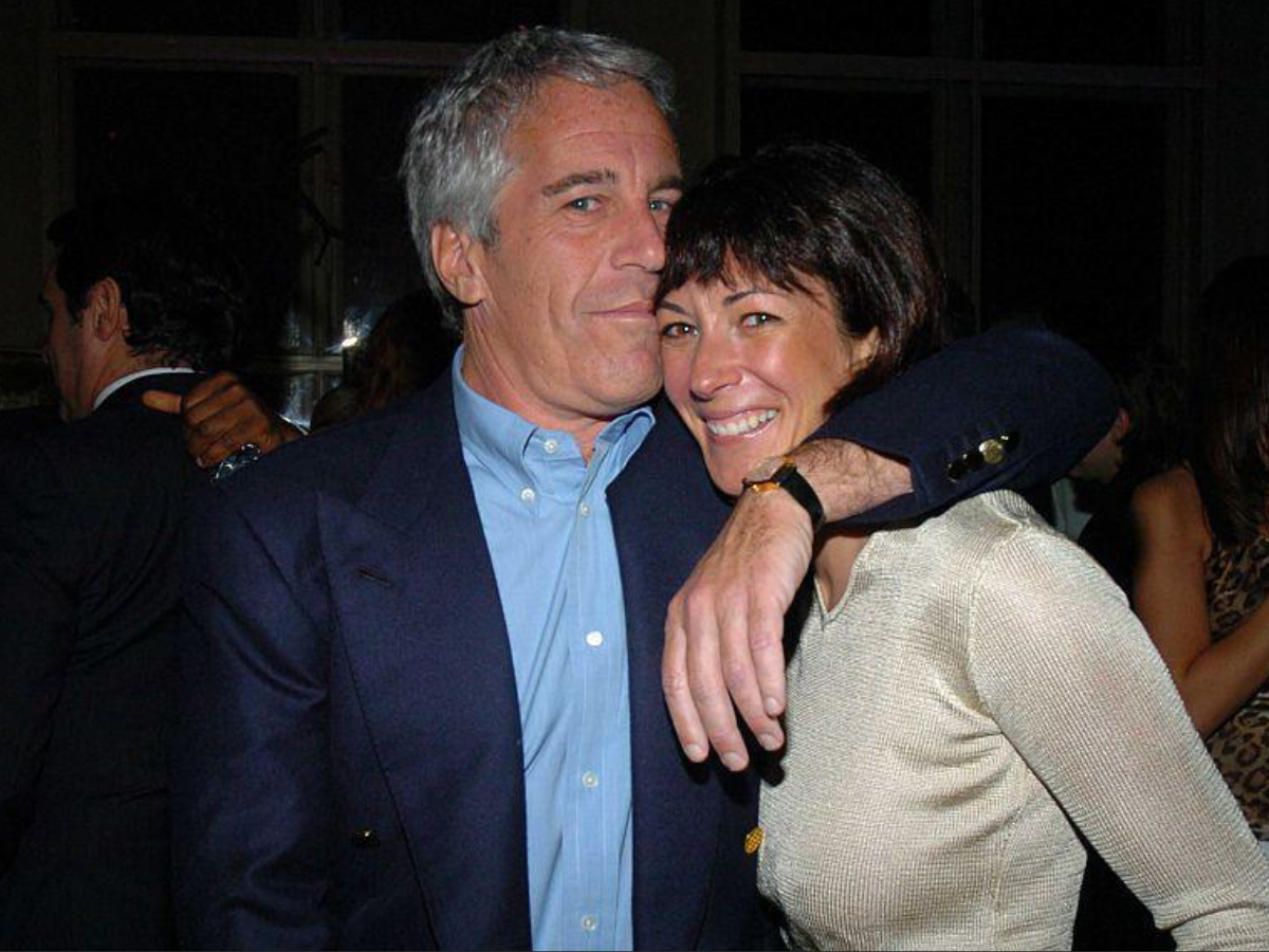 Ghislaine Maxwell smiling in a group photo with Epstein and prominent figures. - Photo Gallery